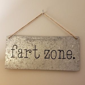 "Fart zone." Bathroom humor sign